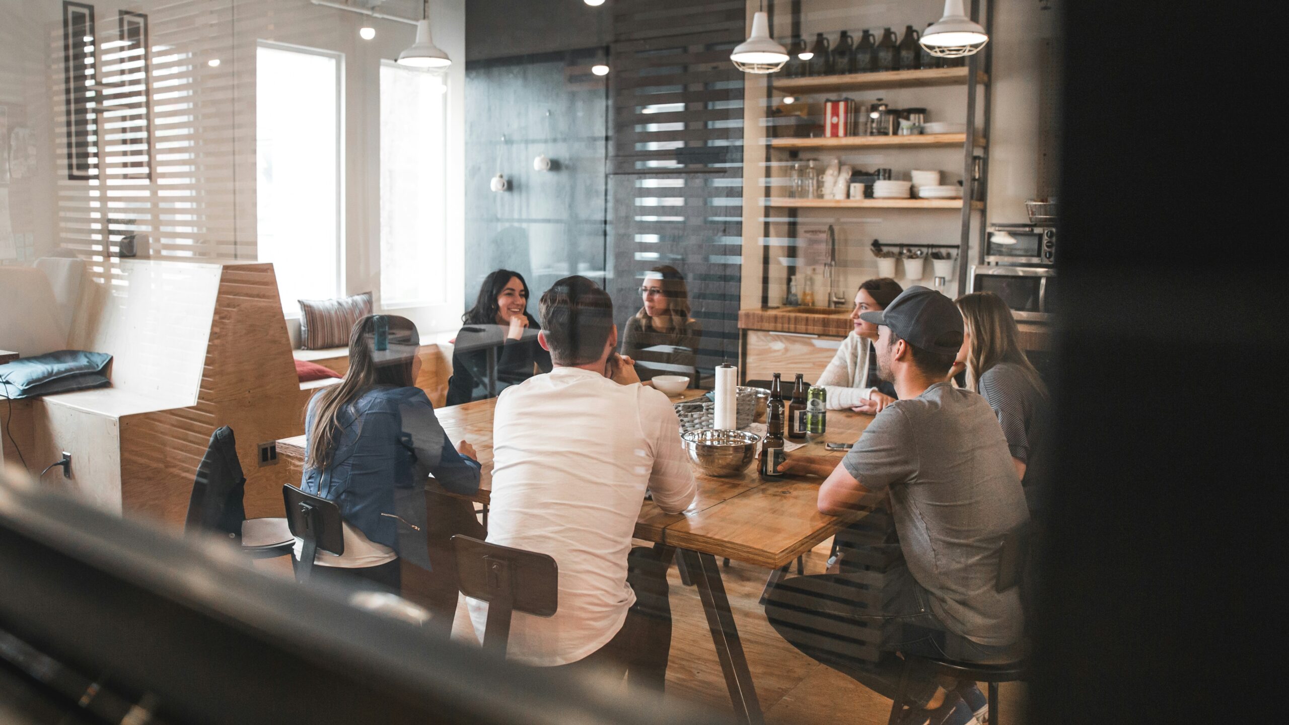 Colleagues around a table discussing a conversation